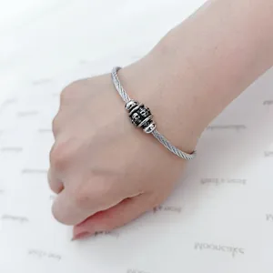 Macro view of the skull bead details on a stainless steel elastic wire bracelet
