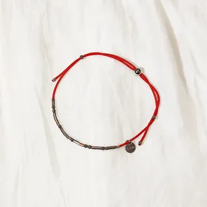 Bracelet ajustable en cordon rouge avec perles en acier inoxydable et breloque S.Steel