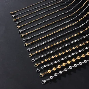 Detail view of various sizes of stainless steel ball chains in gold and silver finish
