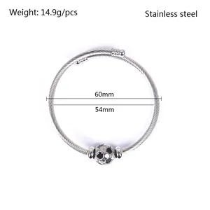 Detailed view of silver stainless steel wire cuff bracelet featuring a soccer ball charm