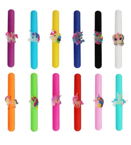 Detailed close-up showing various colorful luminous silicone unicorn slap bracelets for kids.