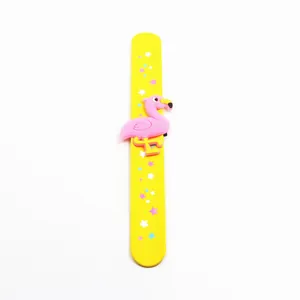 Detailed view of yellow flamingo slap bracelet with colorful star patterns.