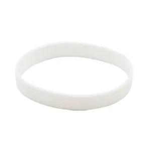Detailed macro view of a plain white luminous silicone wristband with smooth finish