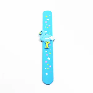 Detailed view of a bright blue silicone slap bracelet featuring a 3D flamingo and stars