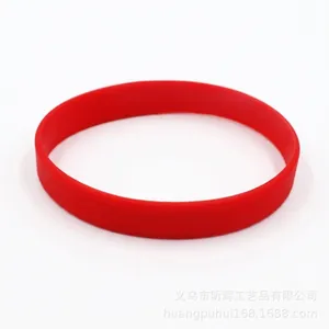 Close-up detail of a vibrant red luminous silicone wristband for sports and events
