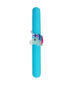 Close-up of a blue silicone slap bracelet featuring a colorful cartoon unicorn decoration.