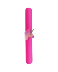 Detail of a pink silicone slap bracelet featuring a colorful cartoon unicorn decoration