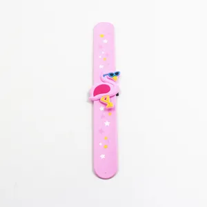 Detailed view of pink flamingo slap bracelet with star patterns and silicone character decoration.