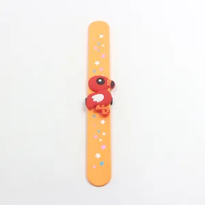 Vibrant orange silicone flamingo slap bracelet with colorful star patterns for party favors