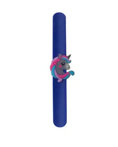 Detailed view of the colorful cartoon unicorn charm on a blue silicone slap bracelet for kids