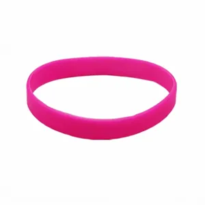 Detailed view of a bright pink silicone luminous wristband on white background