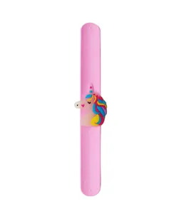 Detailed view of pink silicone slap bracelet with colorful cartoon unicorn charm