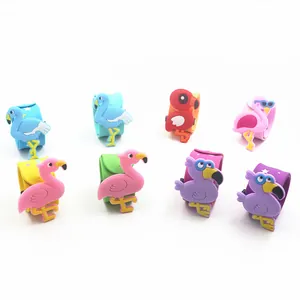 Detailed view of colorful flamingo silicone slap bracelets with star patterns for party favors.