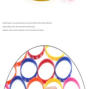 Detailed view of colorful elastic silicone wristbands with white animal paw prints.