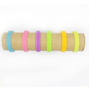Close-up detail of colorful luminous silicone wristbands arranged on a display stand