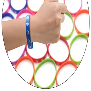 Detailed view of colorful silicone wristbands with cat paw print worn on wrist