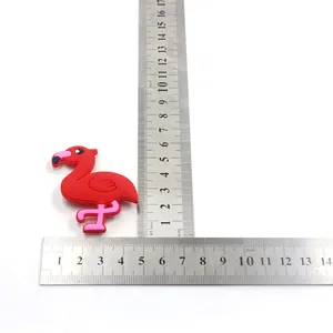 Detailed measurement showing the dimensions of the red flamingo PVC slap bracelet.