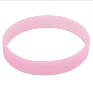 Detail view of a pink silicone glow-in-the-dark wristband for gifts and events.