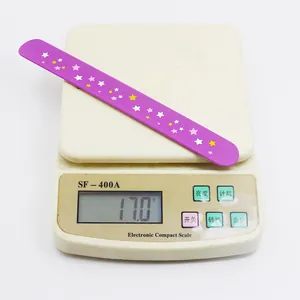 Detail view of a purple star-patterned slap bracelet weighing 17.0g on a digital scale.