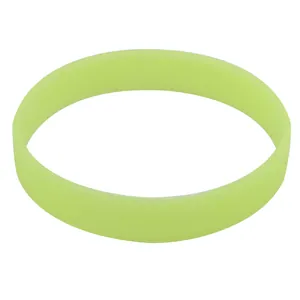 Detail macro view of a luminous green silicone wristband with a smooth matte finish.