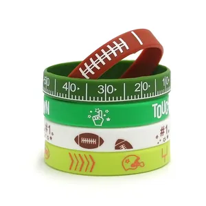 Colorful football themed silicone wristbands with field markings and sports icons