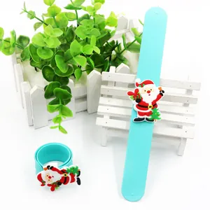 Close-up detail of blue Christmas silicone slap bracelet with cute Santa Claus motif.