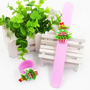 Detail of pink silicone slap bracelet with green Christmas tree decoration