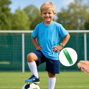 Green sports silicone wristband with soccer patterns for children in soccer field setting