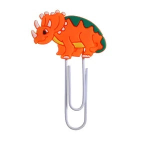 Detailansicht eines niedlichen orangefarbenen PVC-Büroklammer-Lesezeichens mit Dinosaurier