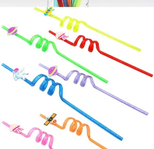 Assorted colorful reusable plastic spiral straws featuring space and cartoon decorations for parties