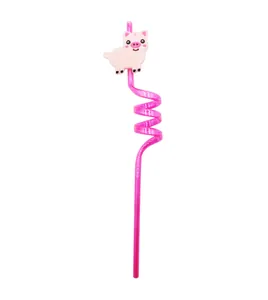 Close-up of pink spiral reusable drinking straw with a cute cartoon pig accessory