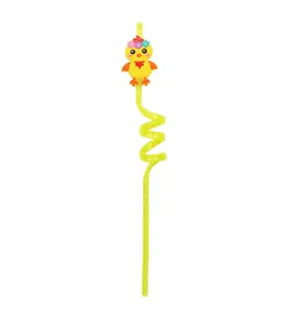 Close-up view of a yellow spiral reusable straw featuring a cute cartoon chick topper