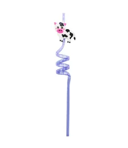 Macro view of the cute cartoon cow decorative charm on a purple spiral reusable straw