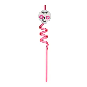 Detailed view of pink spiral Halloween straw with a decorative sugar skull topper