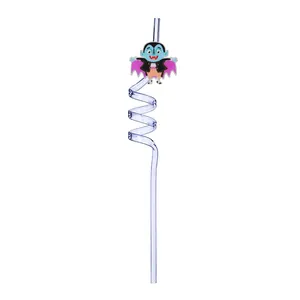 Close-up detail of a reusable Halloween spiral straw with a cute cartoon vampire bat charm