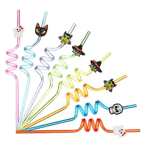 Close-up detail of colorful Halloween spiral straws featuring cute cartoon character charms