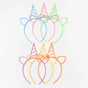 Detail view of colorful plastic unicorn headbands for party favors and festive gifts.