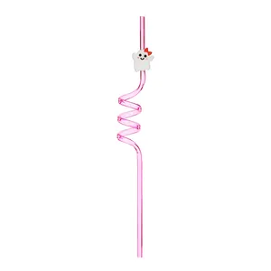 Detail shot of a pink reusable spiral straw featuring a cute white cartoon ghost