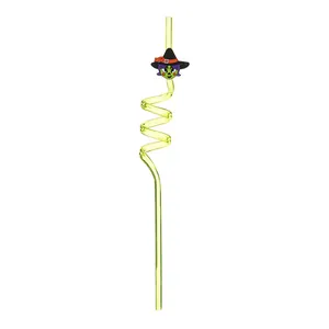 Detailed view of a reusable yellow spiral Halloween drinking straw with a cute witch charm