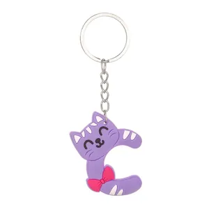 Detail view of a purple PVC letter C keychain featuring a cute cat face and a pink bow decoration