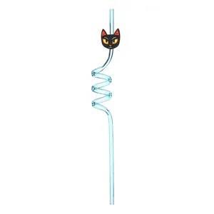 Detail view of blue spiral Halloween straw with a cartoon black cat accessory