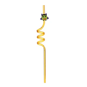Close-up detail of Halloween yellow spiral reusable straw with cute vampire character.
