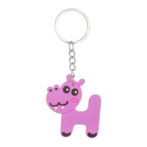 Close-up of a cute pink PVC hippo keychain designed in the shape of the letter H
