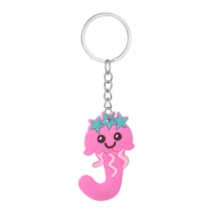 Detailed view of a cute pink PVC jellyfish shaped alphabet J keychain pendant with stars