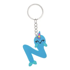 Detailed macro view of a cute blue PVC narwhal keychain shaped like the letter N