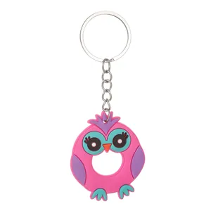 Detailed view of pink owl-shaped letter O keychain made of soft PVC for bags or car keys.