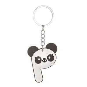 Detailed macro view of the letter P panda-themed soft PVC keychain with a silver metal ring