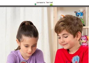 Two happy children playing with educational luminous dinosaur skeleton toy set models