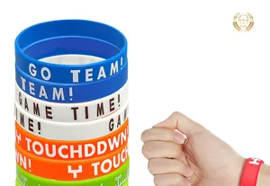 Detailed view of sports silicone wristbands with inspirational text slogans.
