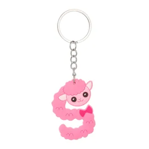 Close-up of pink letter S keychain featuring a cute cartoon sheep design in PVC